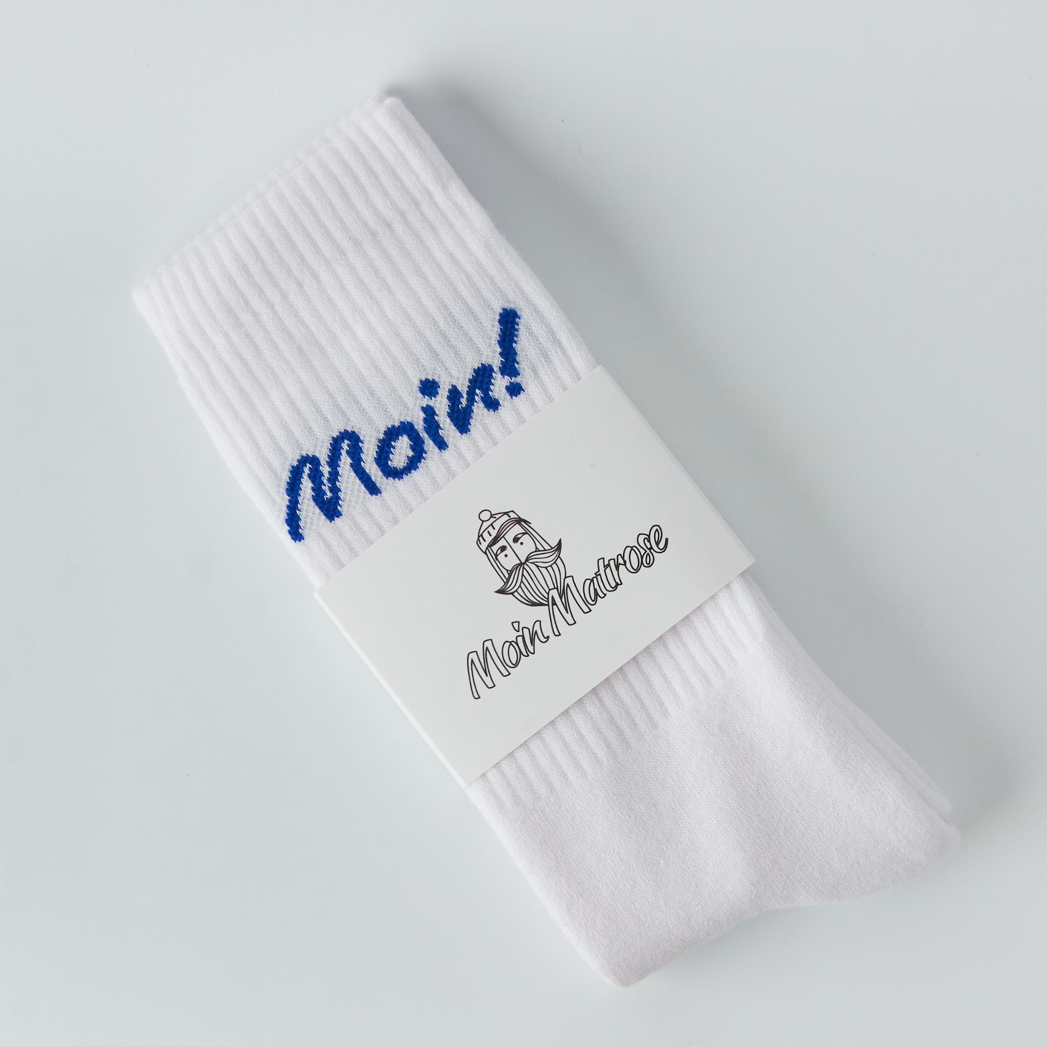 Weiße Fangfrisch Socken in Verpackung mit maritimem Logo „Moin Matrose“